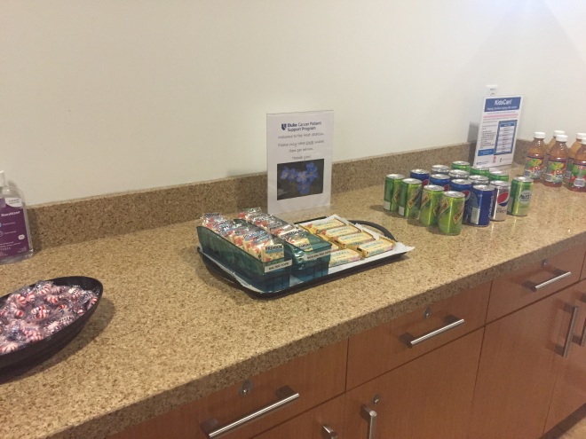 Here is a counter full of complimentary snacks and drinks for cancer patients. Very thoughtful but unfortunately did not have a single option that wasn't full of sugar or processed junk. Nutrition is not stressed enough the cancer center 😁